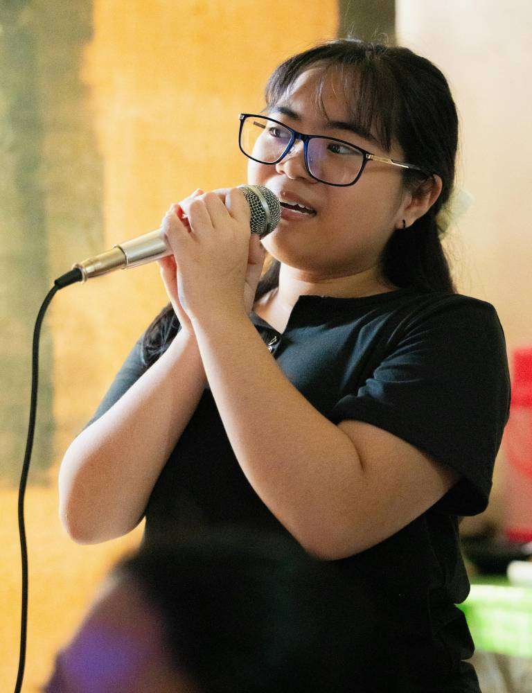Woman singing — vocal cord and hoarse voice specialist Singapore